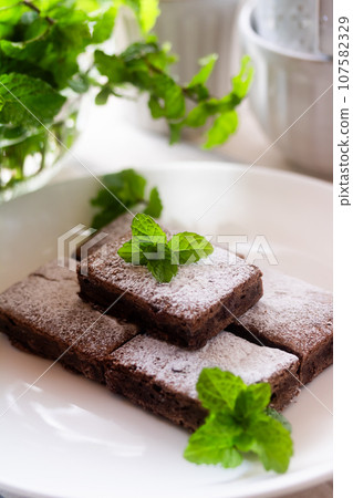 Brownie (chocolate cake) and mint Brownie (chocolate cake) and mint 107582329