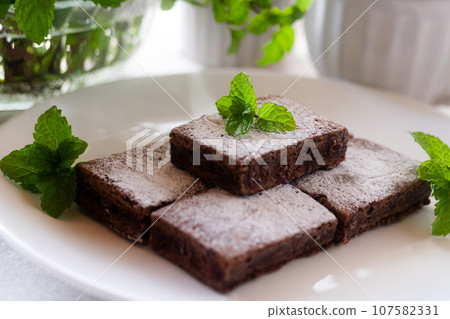 Brownie (chocolate cake) and mint Brownie (chocolate cake) and mint 107582331