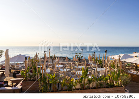 Morning view and beach restaurant in Nice, France 107582905