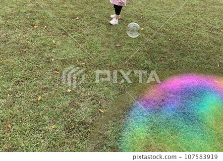 lawn, soap bubbles and child 107583919