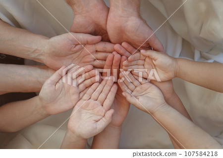 Palm hands. Woman, man and kids hand closeup together 107584218