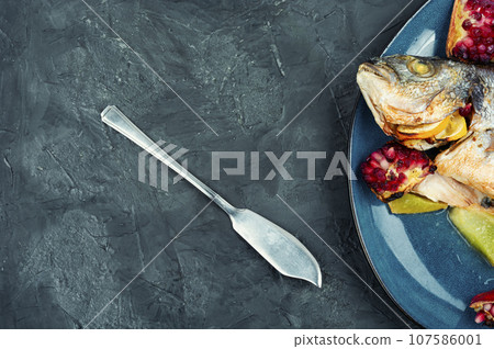 Dorado fish cooked with melon, copy space. 107586001