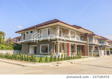 New residential house contemporary style building in progress at construction site New residential house contemporary style building in progress at construction site 107586459