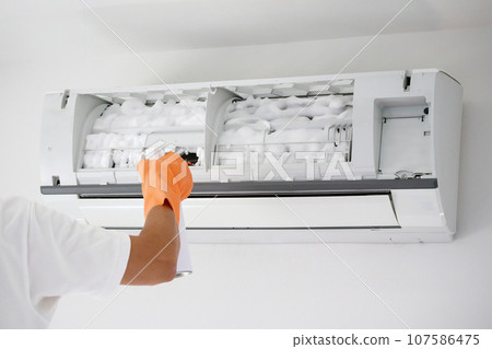 air conditioner cleaning with spray foam cleaner 107586475