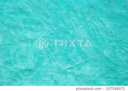 Green towel fabric texture surface close up background Green towel fabric texture surface close up background 107586872