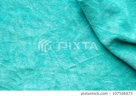 Green towel fabric texture surface close up background 107586873