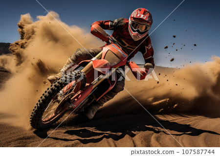 Motocross rider creates a huge cloud of dust and debris 107587744