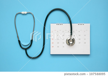 Stethoscope with calendar page date on blue background doctor appointment medical concept 107588095
