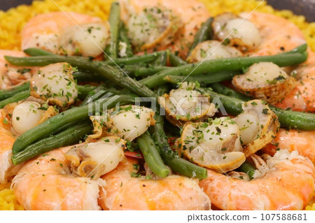 Shrimp and scallop paella, Mediterranean cuisine, saffron yellow rice 107588681