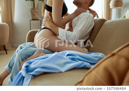 Gorgeous sexy couple enjoying sex on sofa closeup view Gorgeous sexy couple enjoying sex on sofa closeup view 107590484