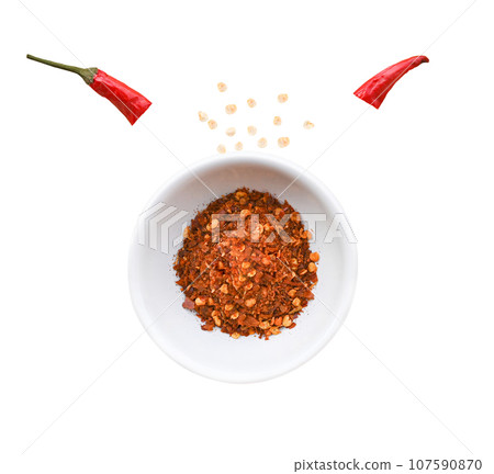 Dried red chili and chili powder in bowl isolated . 107590870