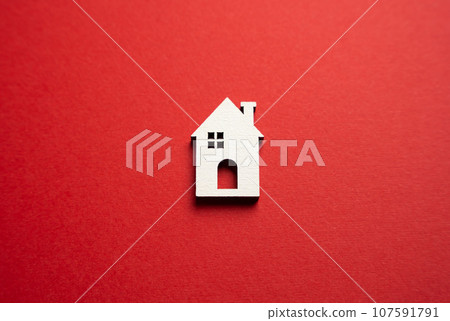 House on a red background. Buying and selling housing. Real estate market review. Construction industry. Property insurance. Design and architectural services. House on a red background. Buying and selling housing. Real estate market review. Construction industry. Property insurance. Design and architectural services. 107591791