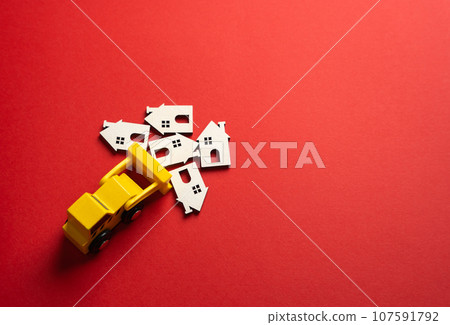 Bulldozer demolishes houses, concept. Plan for the renewal and restoration of residential areas. Clearing for new construction. Bulldozer demolishes houses, concept. Plan for the renewal and restoration of residential areas. Clearing for new construction. 107591792