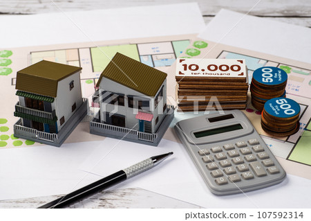 Image of home purchase or rental contract and money 107592314