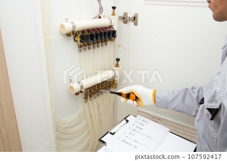 Image of construction, inspection, and maintenance of residential hot water floor heating equipment 107592417