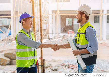 builder worker meeting hand shaking with project manager engineer team leader for success job deal teamwork people 107595803