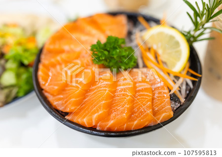 Salmon Sashimi, popular raw fish seafood serve in Japanese restaurant high nutrition with omega oil menu Salmon Sashimi, popular raw fish seafood serve in Japanese restaurant high nutrition with omega oil menu 107595813