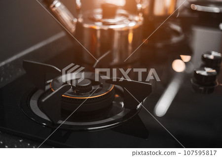 Stove in modern kitchen clean new glass top luxury elegant design for cooking black color tone. Stove in modern kitchen clean new glass top luxury elegant design for cooking black color tone. 107595817