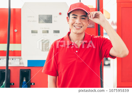 Portrait Gas station service staff Asian male worker happy smiling working car gasoline refill service job. Portrait Gas station service staff Asian male worker happy smiling working car gasoline refill service job. 107595839