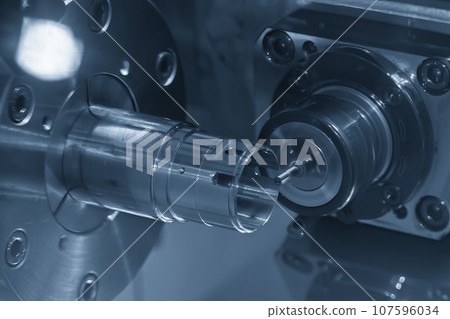 The multi-tasking CNC lathe machine cutting the metal cylindrical parts by milling spindle. The multi-tasking CNC lathe machine cutting the metal cylindrical parts by milling spindle. 107596034