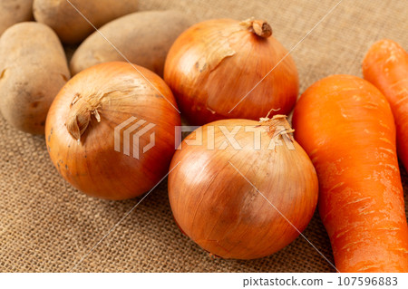 onions, potatoes, carrots onions, potatoes, carrots 107596883