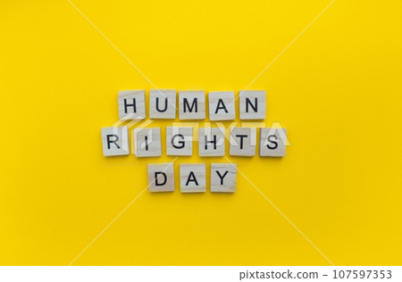 December 10, Human Rights Day, minimalistic banner with the inscription in wooden letters 107597353