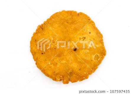 Crispy and salty mathri on white background with selective focus 107597435