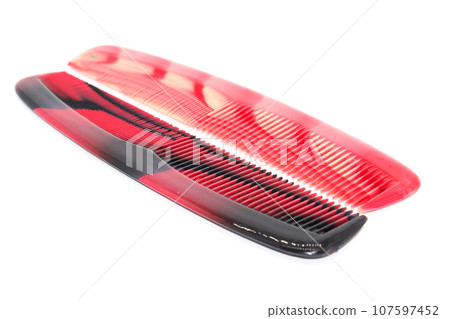 Hair comb isolated on white background with selective focus Hair comb isolated on white background with selective focus 107597452