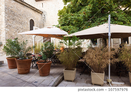 Open cafe restaurant in a small French village Open cafe restaurant in a small French village 107597976