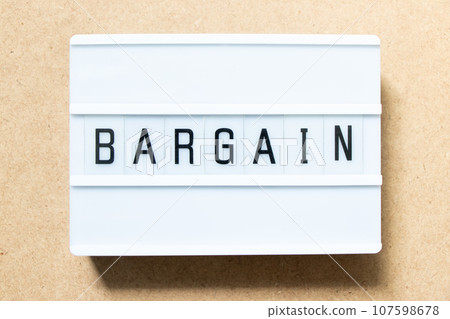 Lightbox with word bargain on wood background 107598678
