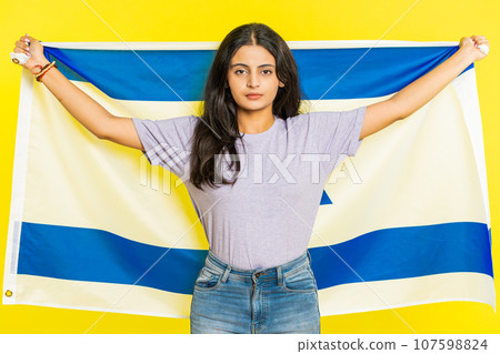 Indian woman holds Israel national flag showing protest against war, hoping for success and win 107598824