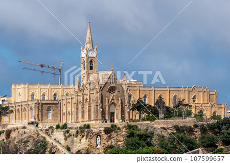 Malta, Gozo, view of Our Lady of Lourdes, Mgarr church on top of a hill Malta, Gozo, view of Our Lady of Lourdes, Mgarr church on top of a hill 107599657