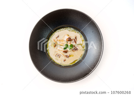 Mushroom cream soup with chiken. Food in asian style isolated. 107600268