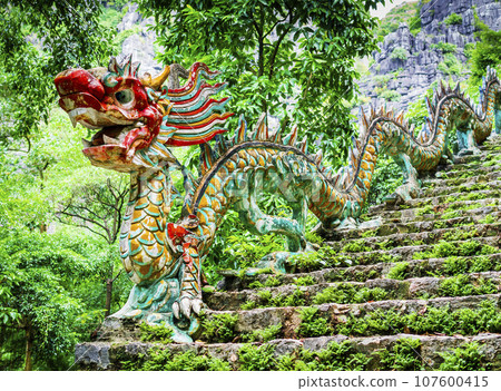 Carved stone dragon stone along the staircase to Hang Mua pagoda and Mua cave, one of the most beautifiul viewpoint in Ninh Binh, Vietnam Carved stone dragon stone along the staircase to Hang Mua pagoda and Mua cave, one of the most beautifiul viewpoint in Ninh Binh, Vietnam 107600415