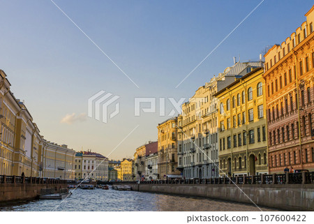 Stunning view of Moyka river flowing through the monumental palaces of Saint Petersburg, Russia 107600422