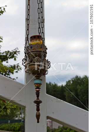 Icon-lamp on wooden cross 107601591