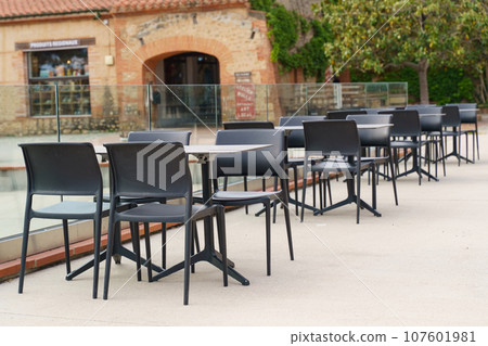 Plastic tables and chairs in a cafe empty in the morning, without people. Plastic tables and chairs in a cafe empty in the morning, without people. 107601981