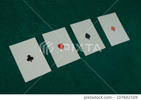 Old west era playing cards on gambling table. Four of a kind, aces. 107602589