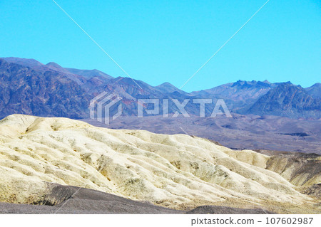 Red mountain slopes and desert in America. 107602987