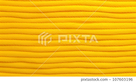 Yellow nylon texture as background. 107603196