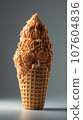 Vertical appetizing caramel ice cream on the table. Dessert. Ice cream in a waffle cup melts while standing on a white table, surrounded by waffle crumbs 107604836