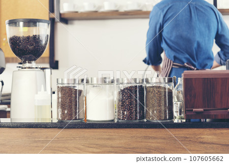 Close up hands coffee barista man make hot cup espresso shot from coffee machine. Cappuccino with milk in italian coffee shop cafe. Close up hands of barista use machine make black drinking hot cup 107605662