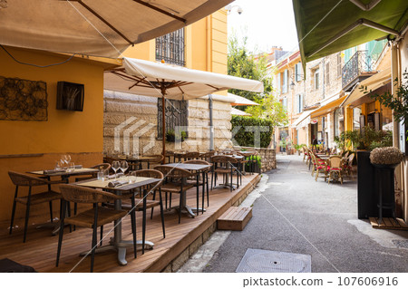 Open cafe restaurant in a small French village 107606916