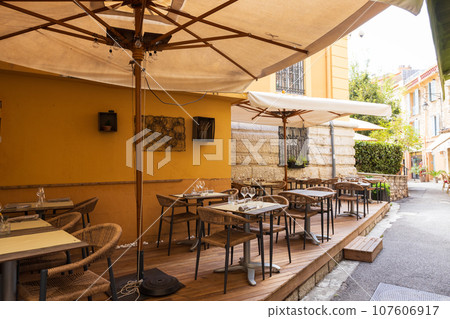 Open cafe restaurant in a small French village Open cafe restaurant in a small French village 107606917