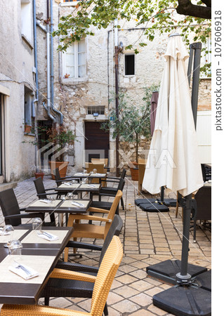 Open cafe restaurant in a small French village 107606918