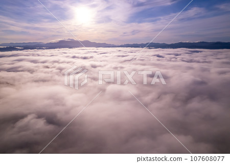 Amazing Sunrise or sunset over mountains hills covered with mist, Aerial view landscape drone shot beautiful colorful nature background 107608077