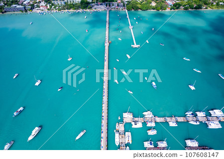 Aerial View Drone shot of Yacht and sailboat parking in marina, Transportation and travel background, Beautiful sea in summer season Aerial View Drone shot of Yacht and sailboat parking in marina, Transportation and travel background, Beautiful sea in summer season 107608147