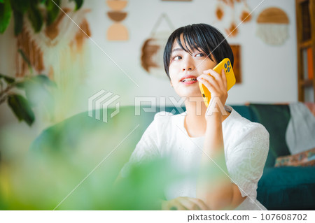 Woman with smartphone 107608702