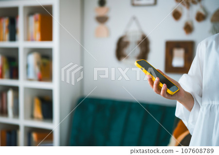 Woman with smartphone Woman with smartphone 107608789