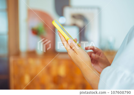 Woman with smartphone Woman with smartphone 107608790